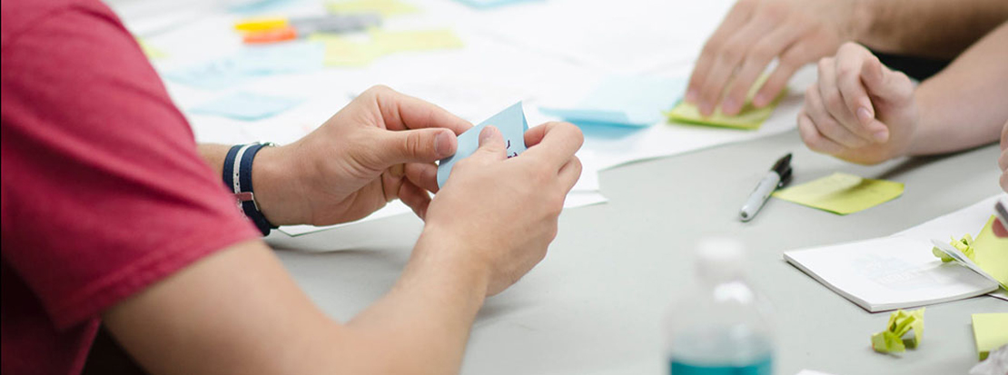 B2B marketing agency using sticky notes to brainstorm during a planning session with a client