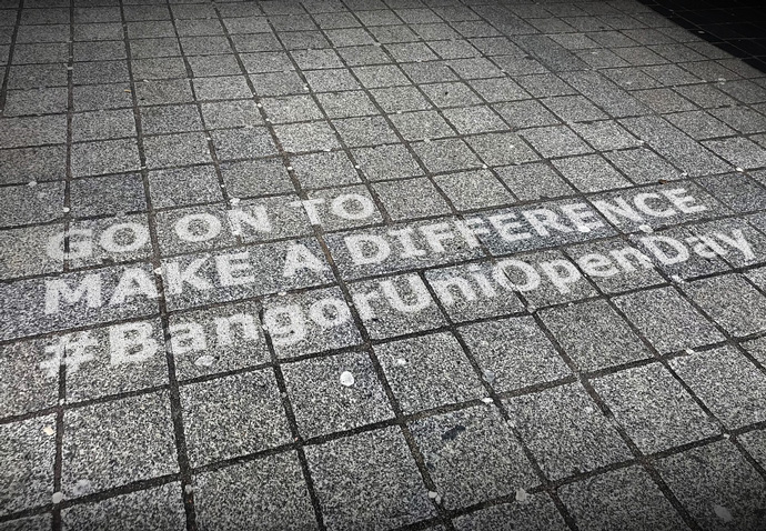 Clean graffiti on a pavement being used to promote Bangor University Open days as part of a guerrilla advertising campaign