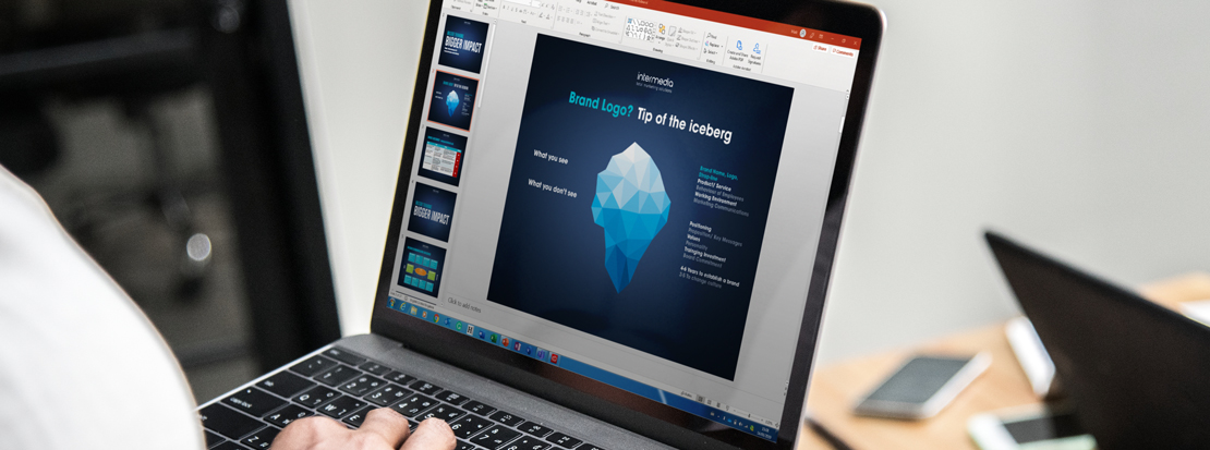 Branding Iceberg' model displayed on a laptop being used during a branding agency workshop