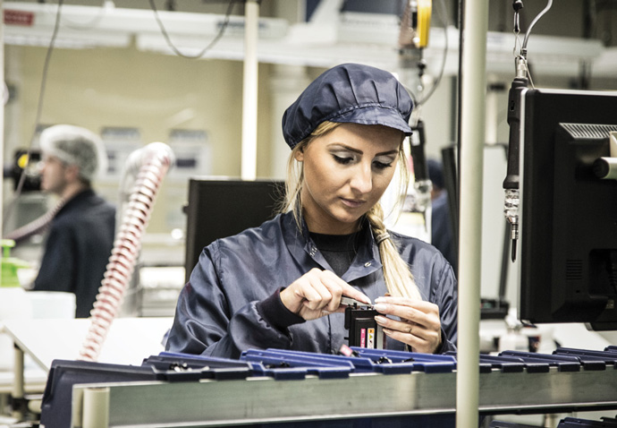 Female worker in a manufacturing facility photographed for Gap's brochure for the manufacturing sector