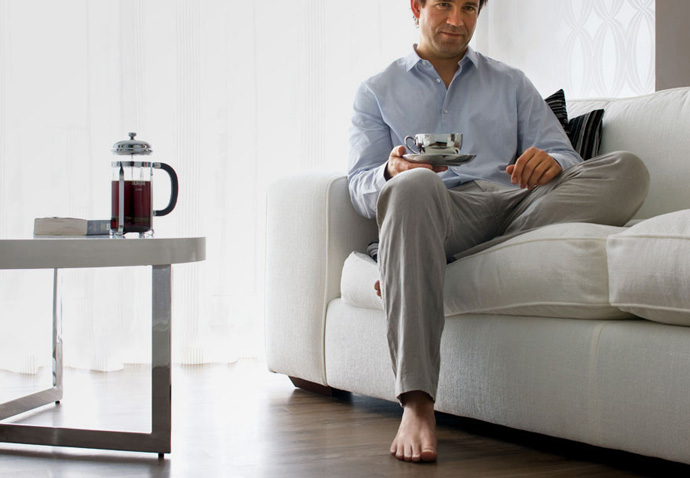 Environmental product photography used in the La Cafetiere ecommerce website design and brochure showing a man holding a coffee cup