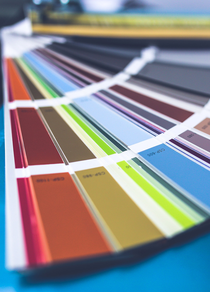 Colour palatte book on the desk of a branding agency designer