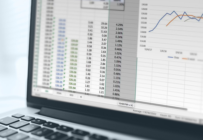 Marketer creating a moving average forecast for a client as part of a strategic marketing plan