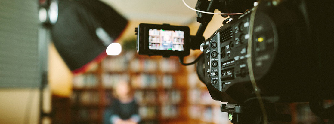 Behind the scenes shot of business woman being interviewed for a social media video