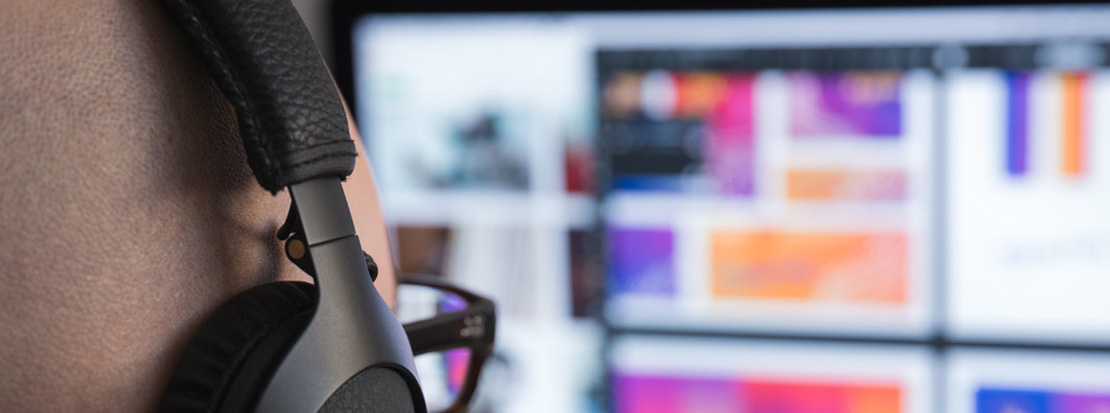 Marketing agency designer creating a website design on a desktop computer